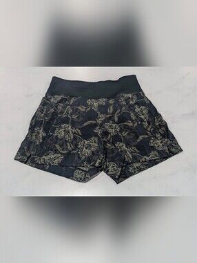 Athleta Dark Green Shorts with Beige Floral Print